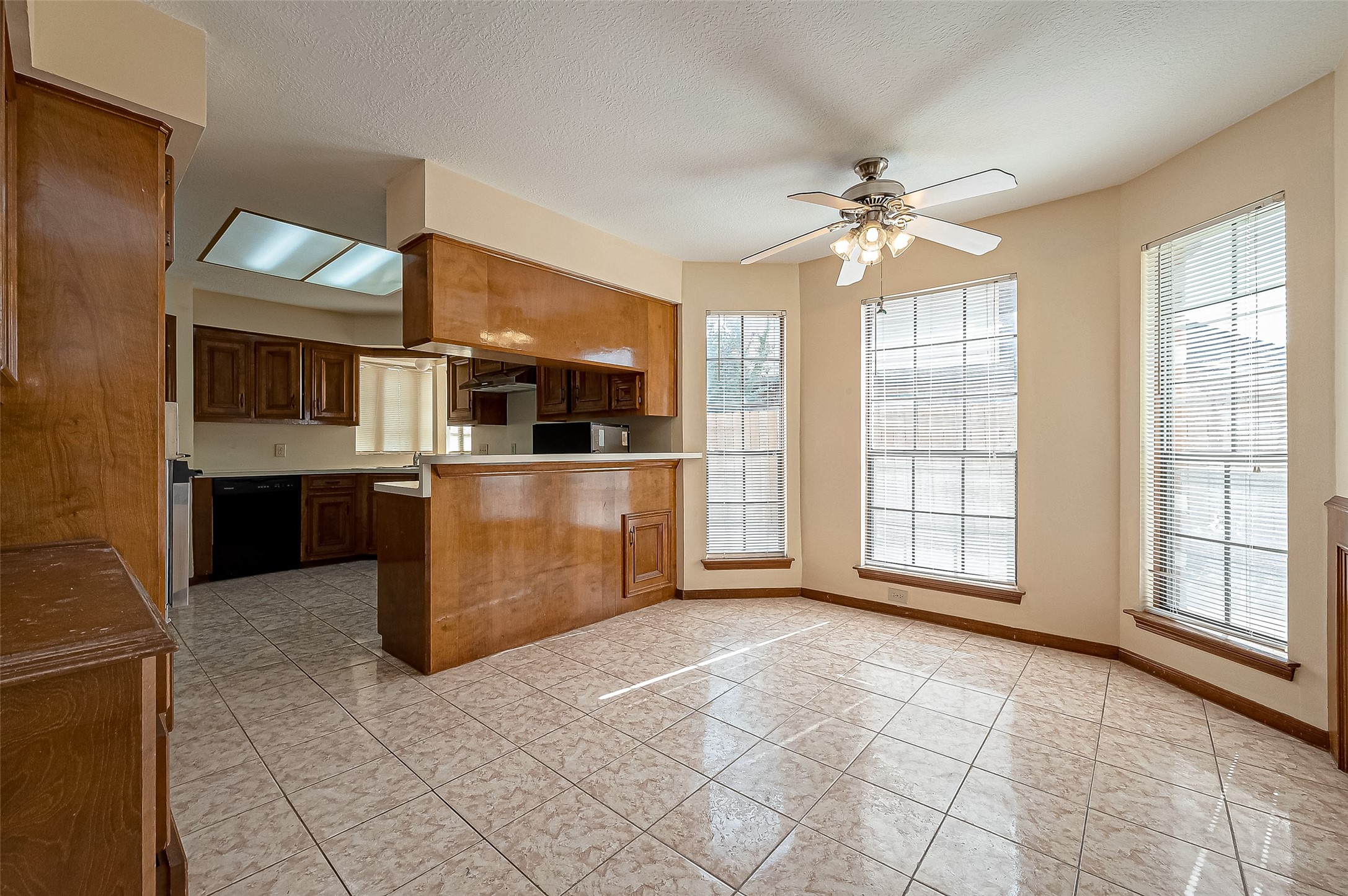 14818 La Rana Drive Houston, TX 77083 - Photo 23 of 50 a view of a kitchen with a sink and windows