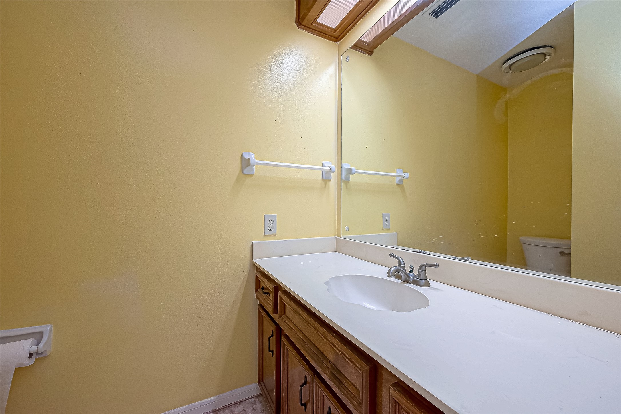 14818 La Rana Drive Houston, TX 77083 - Photo 26 of 50 a bathroom with a sink and a mirror
