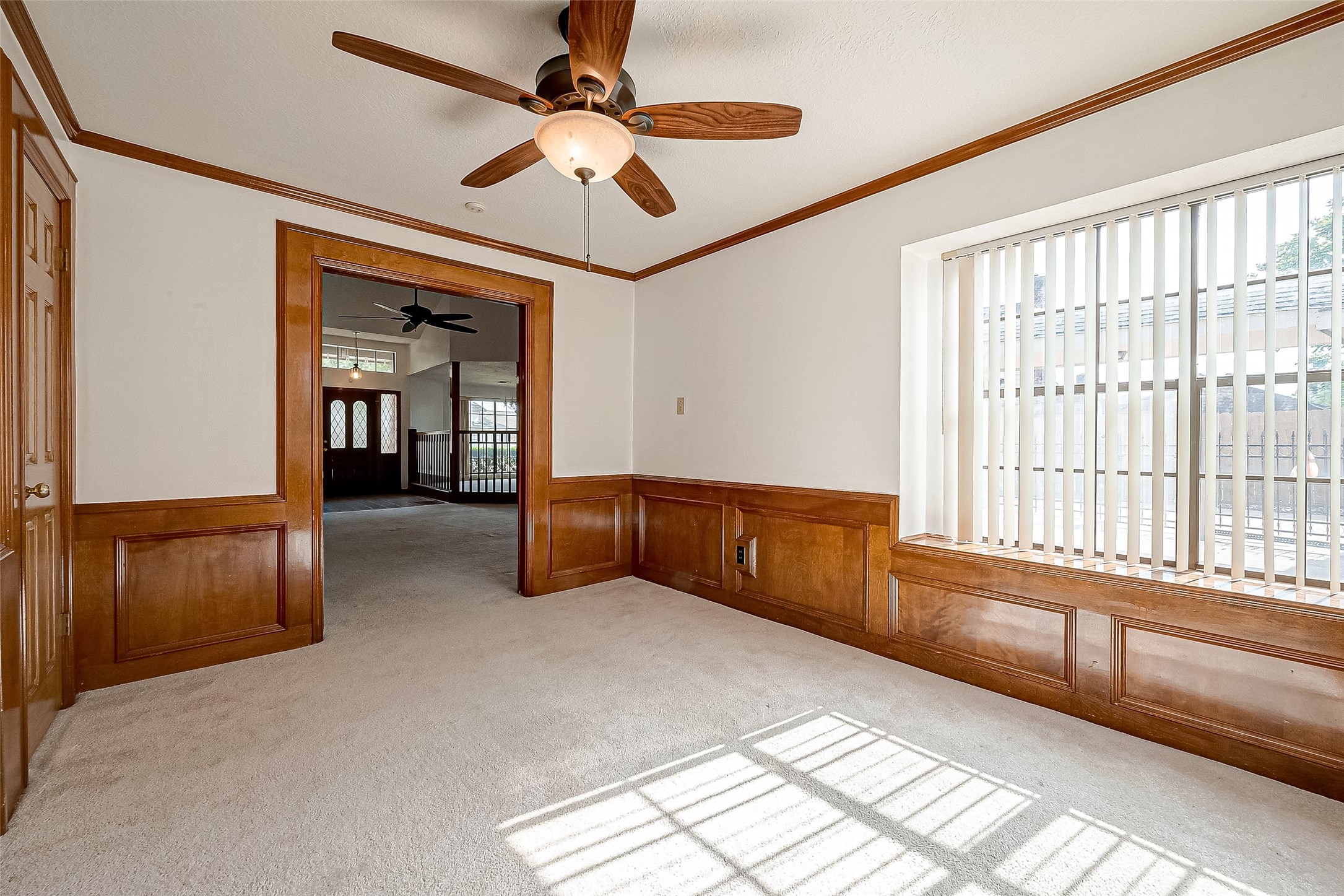 14818 La Rana Drive Houston, TX 77083 - Photo 29 of 50 a living room with furniture and a chandelier