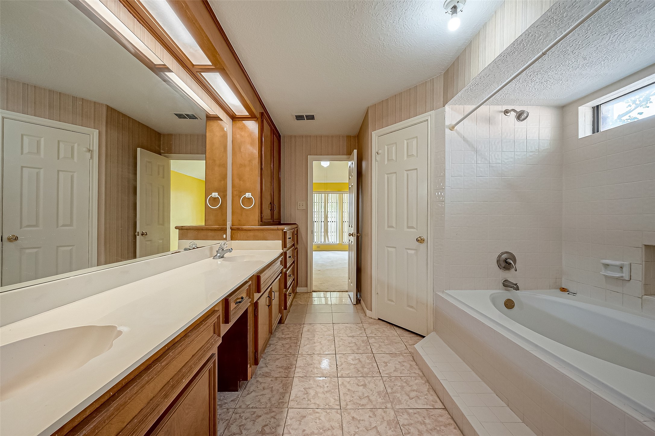 14818 La Rana Drive Houston, TX 77083 - Photo 37 of 50 a spacious bathroom with a tub shower and sink