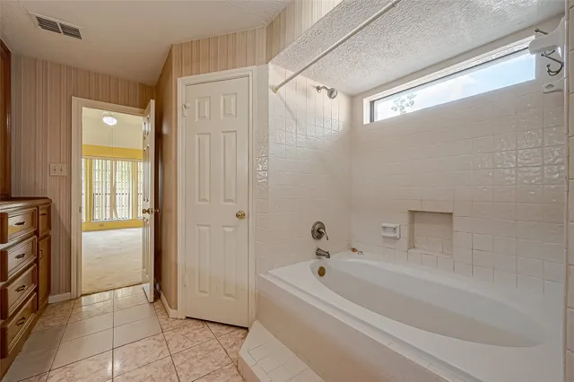 a bathroom with a sink a mirror and a bathtub