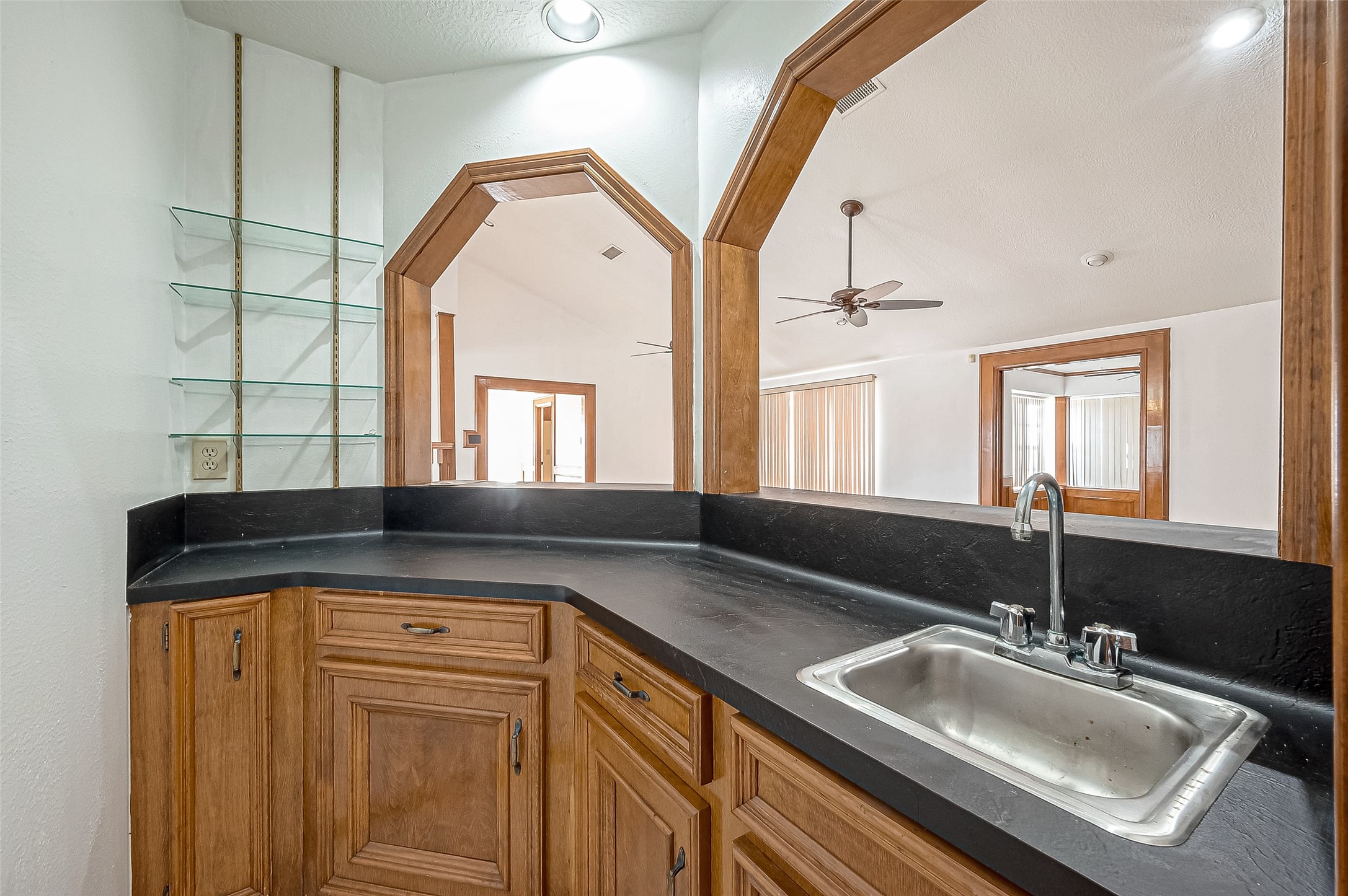 14818 La Rana Drive Houston, TX 77083 - Photo 39 of 50 a bathroom with a sink a mirror and a bathtub