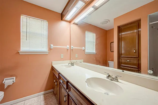 a bathroom with a sink a mirror and a bathtub