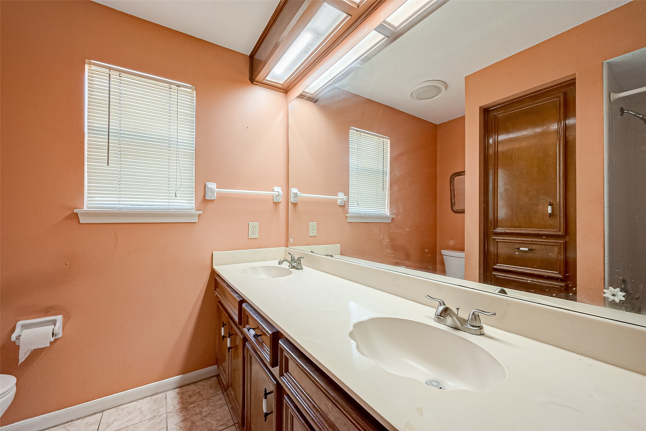14818 La Rana Drive Houston, TX 77083 - Photo 44 of 50 a bathroom with a sink and a mirror