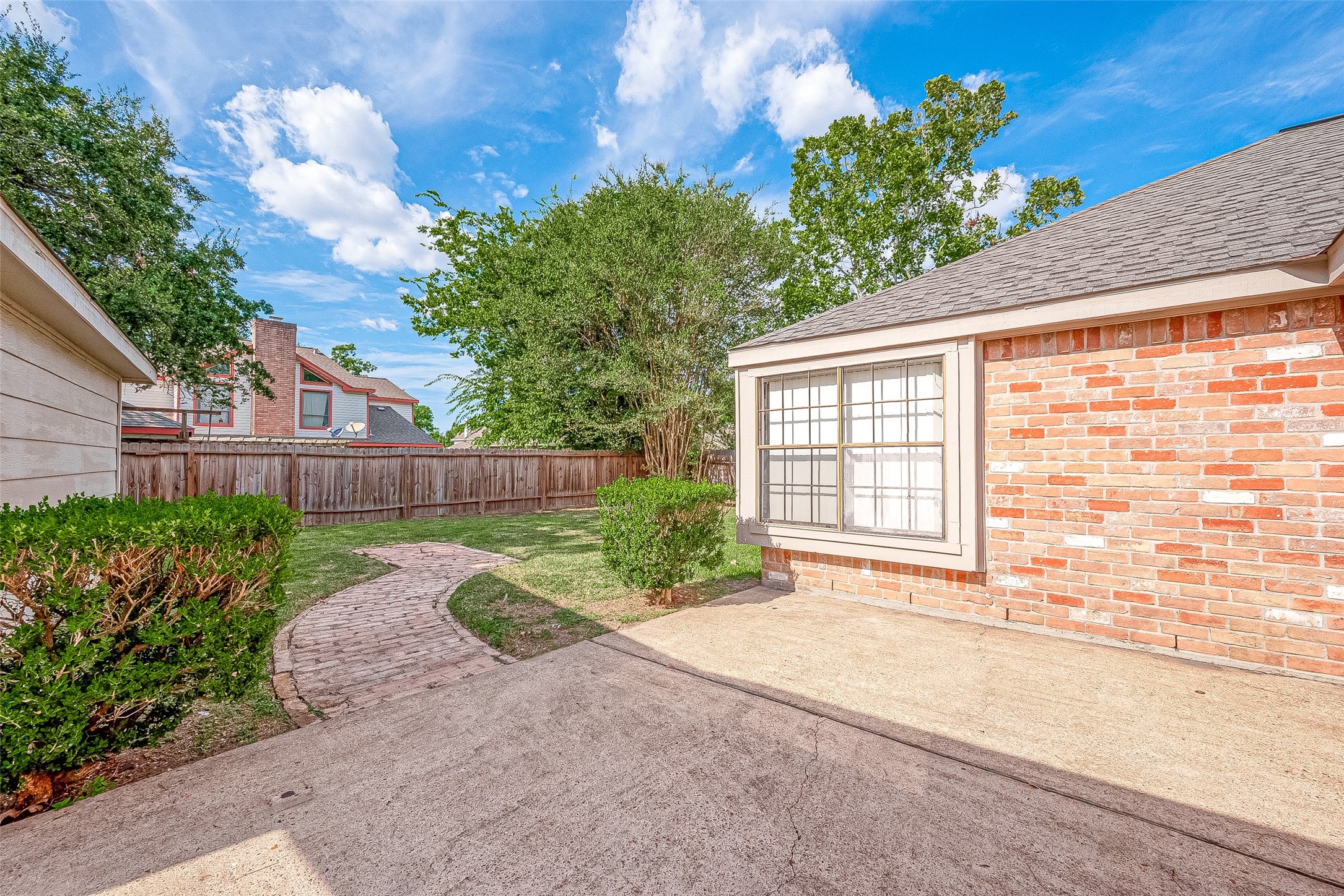 14818 La Rana Drive Houston, TX 77083 - Photo 46 of 50 a view of a backyard with a garden and plants