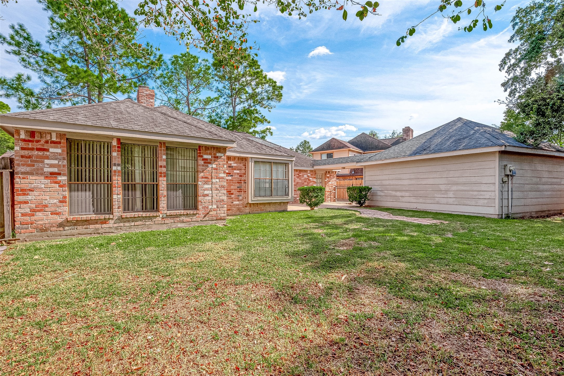 14818 La Rana Drive Houston, TX 77083 - Photo 50 of 50 front view of a house with a garden