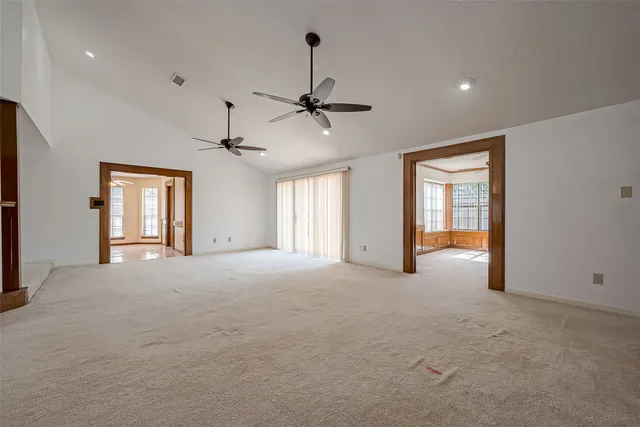 a view of empty room with windows