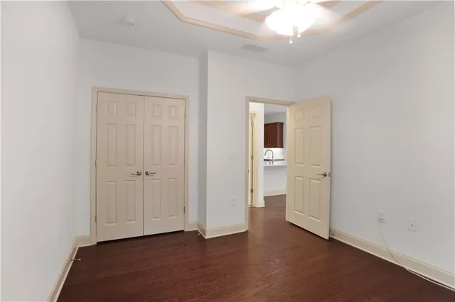 a view of an empty room and closet area
