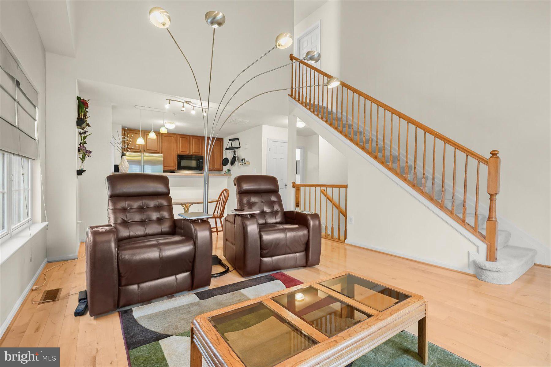 2044 Astilbe Way, Unit 2044 Odenton, MD 21113 - Photo 18 of 56 a living room with furniture and a rug