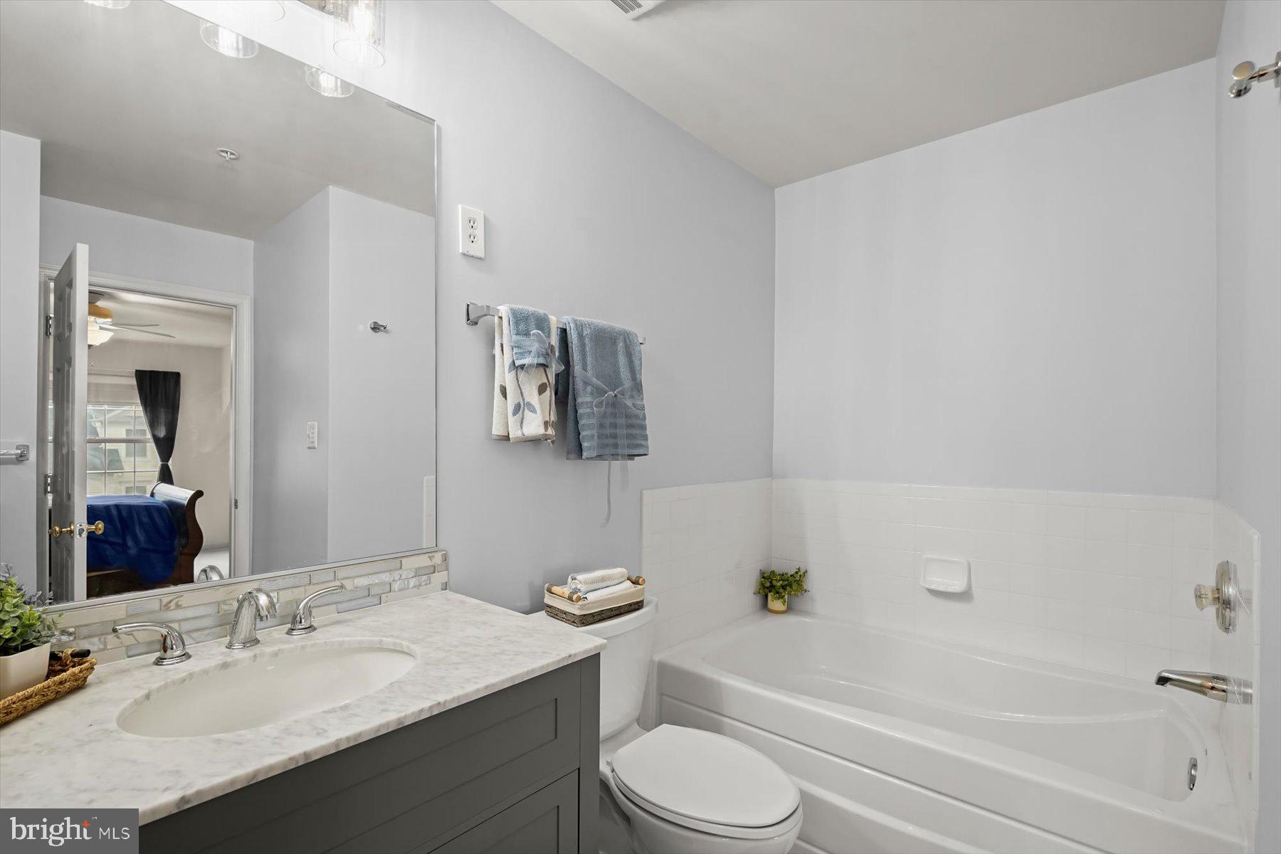 2044 Astilbe Way, Unit 2044 Odenton, MD 21113 - Photo 28 of 56 a bathroom with a sink toilet and bathtub