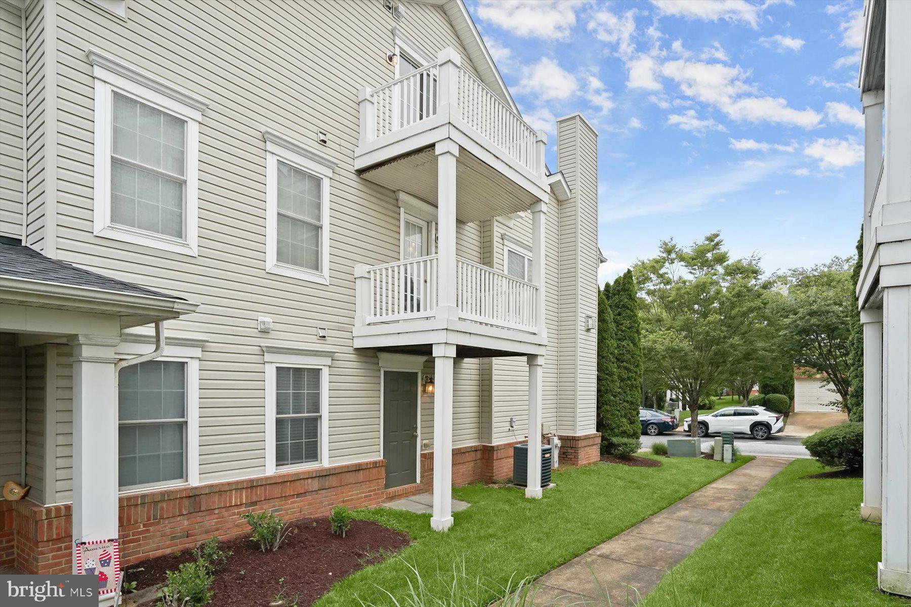 2044 Astilbe Way, Unit 2044 Odenton, MD 21113 - Photo 3 of 56 a front view of a house with a yard