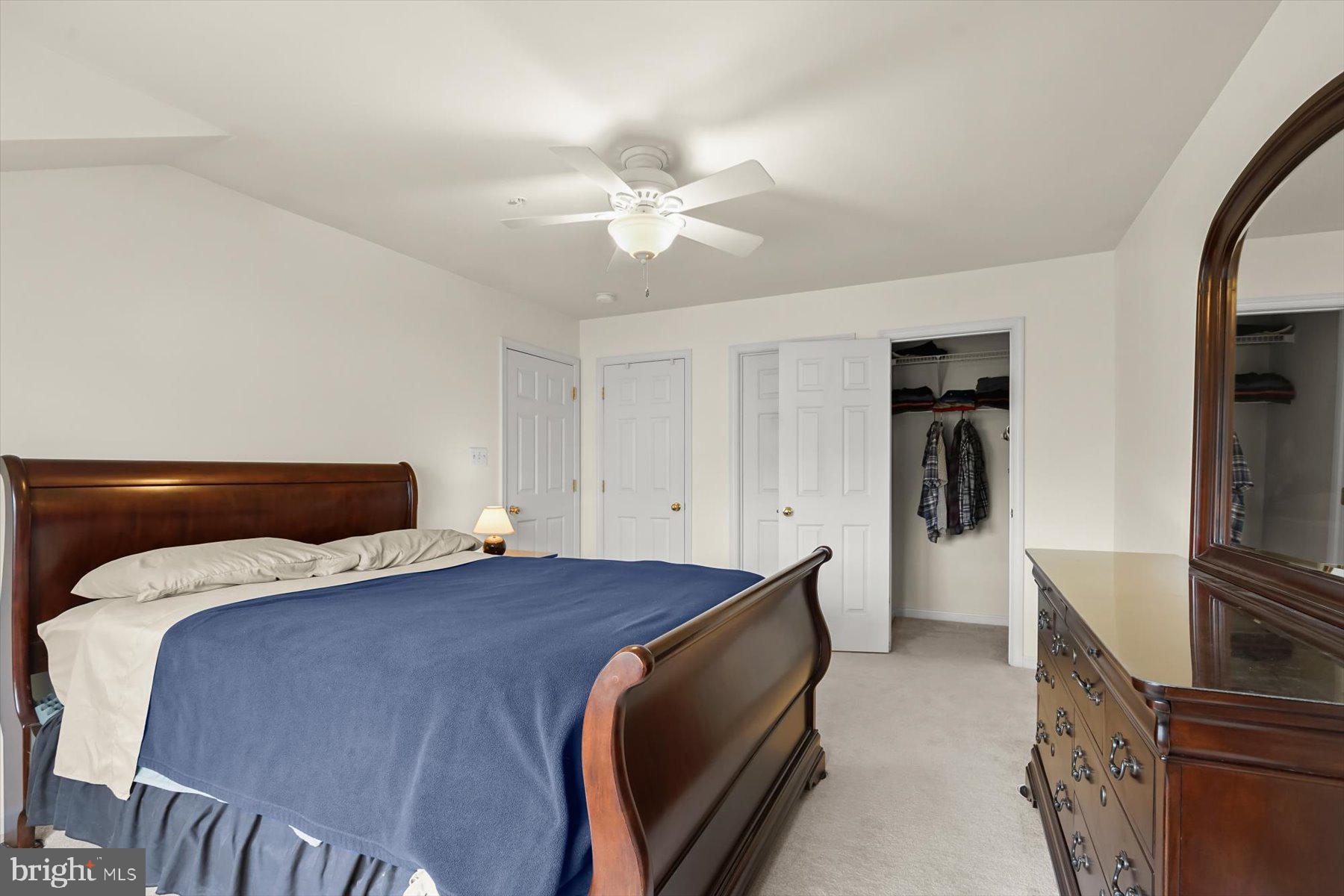 2044 Astilbe Way, Unit 2044 Odenton, MD 21113 - Photo 33 of 56 a bedroom with a bed and a flat screen tv