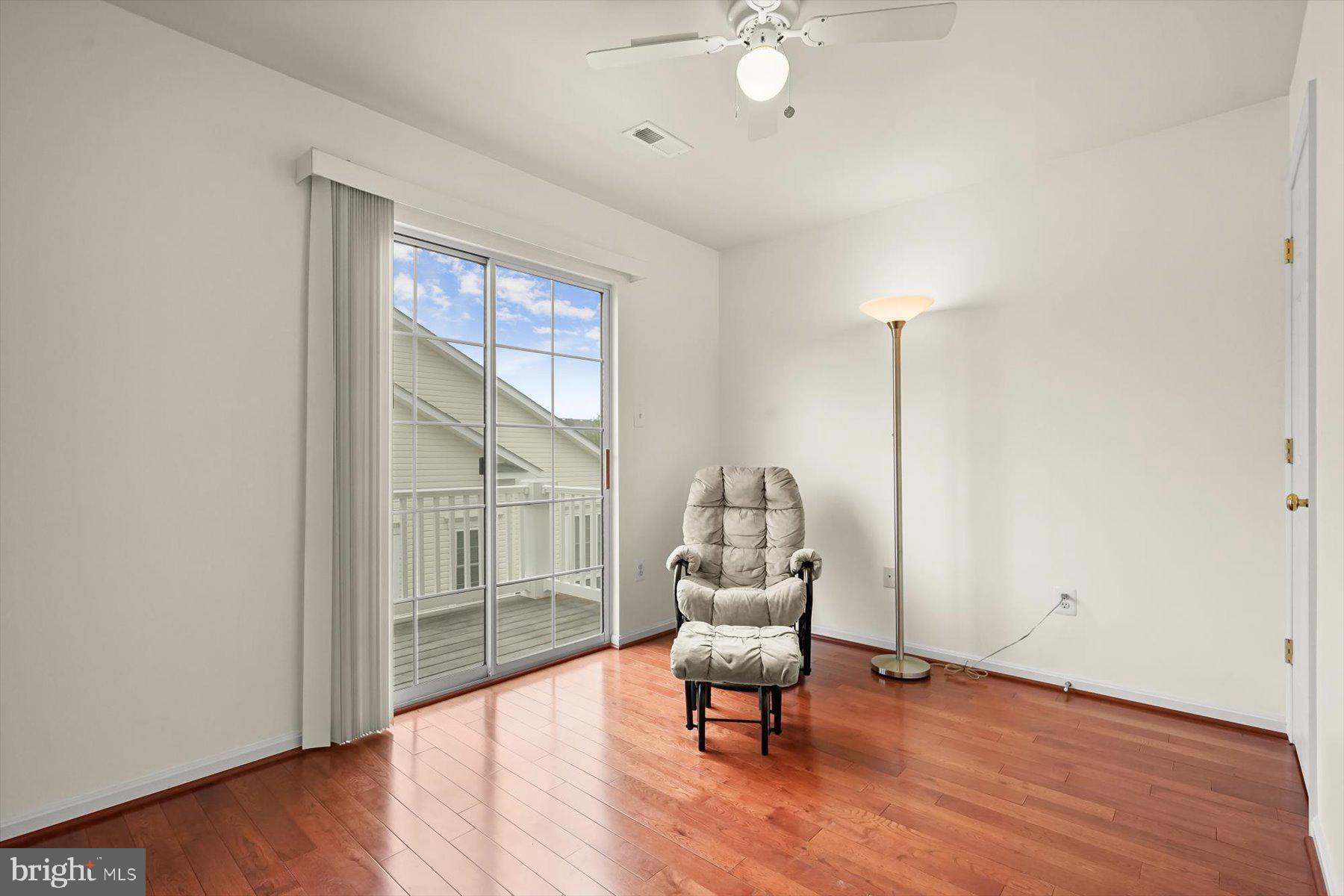 2044 Astilbe Way, Unit 2044 Odenton, MD 21113 - Photo 39 of 56 a view of workspace with wooden floor fan and windows