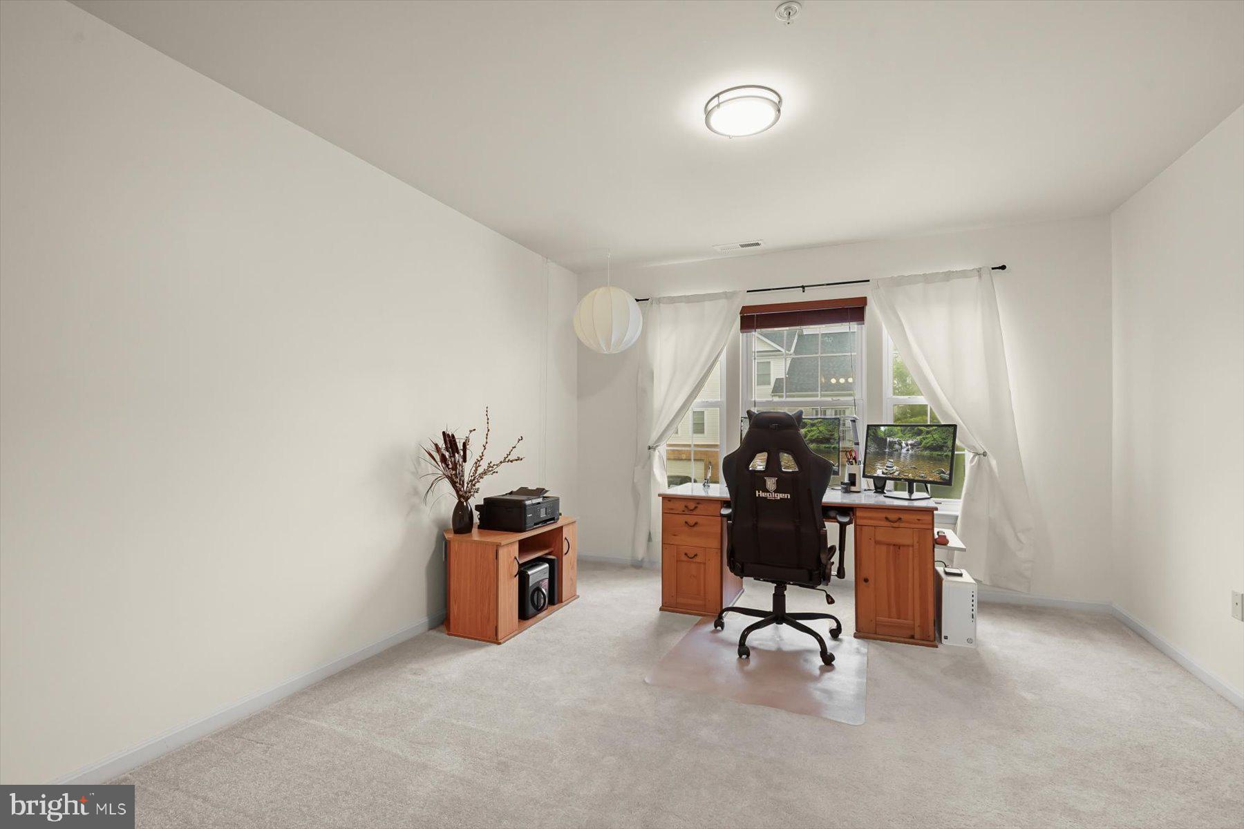 2044 Astilbe Way, Unit 2044 Odenton, MD 21113 - Photo 43 of 56 a workspace with furniture and a window