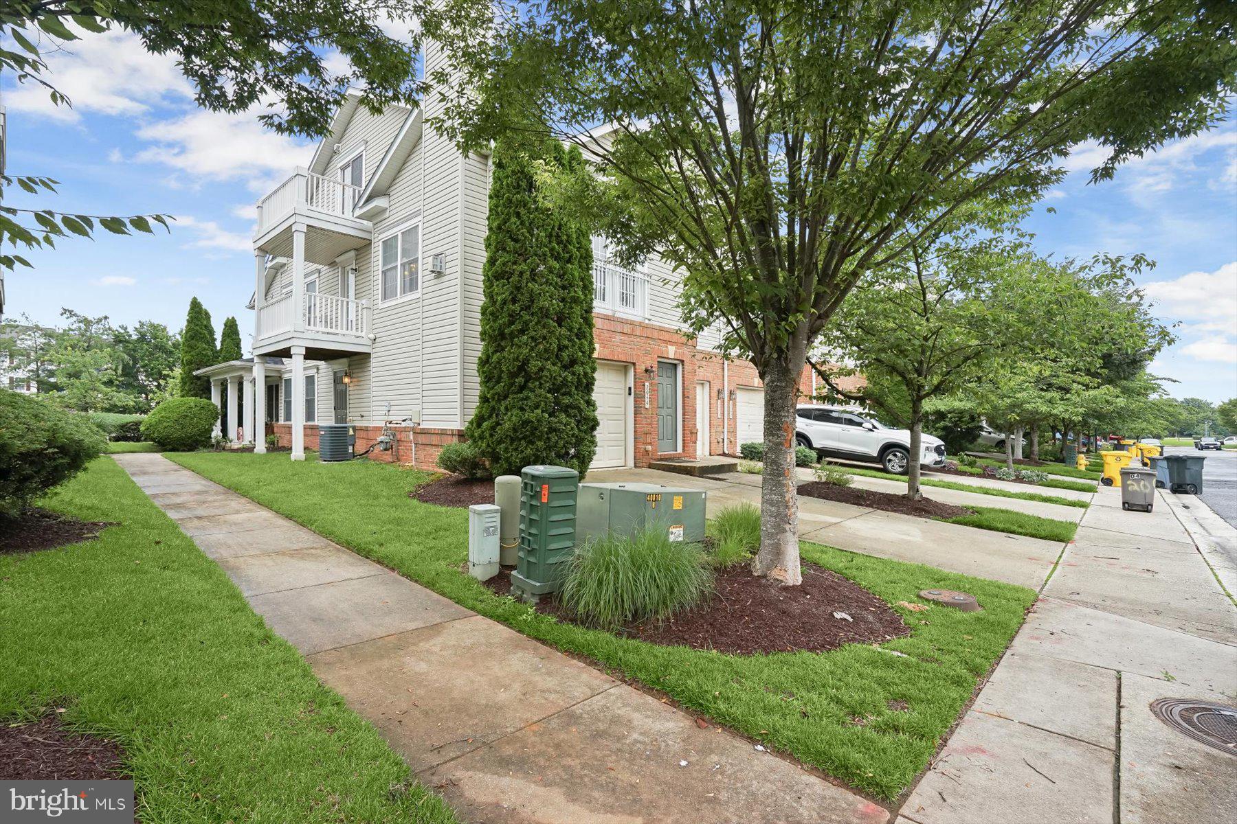2044 Astilbe Way, Unit 2044 Odenton, MD 21113 - Photo 5 of 56 a front view of a house with a yard