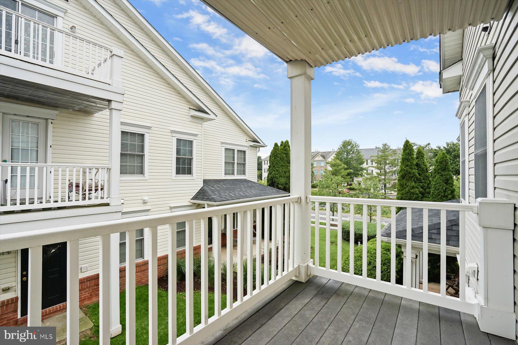 2044 Astilbe Way, Unit 2044 Odenton, MD 21113 - Photo 54 of 56 a view of a house with a wooden deck