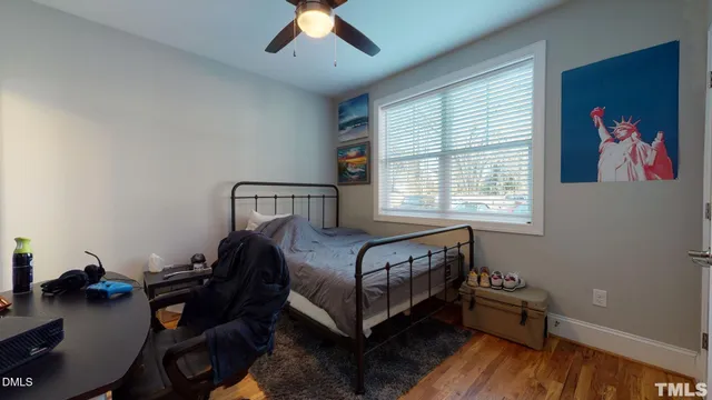 a kitchen with kitchen island a sink dishwasher a stove and a refrigerator with wooden floor