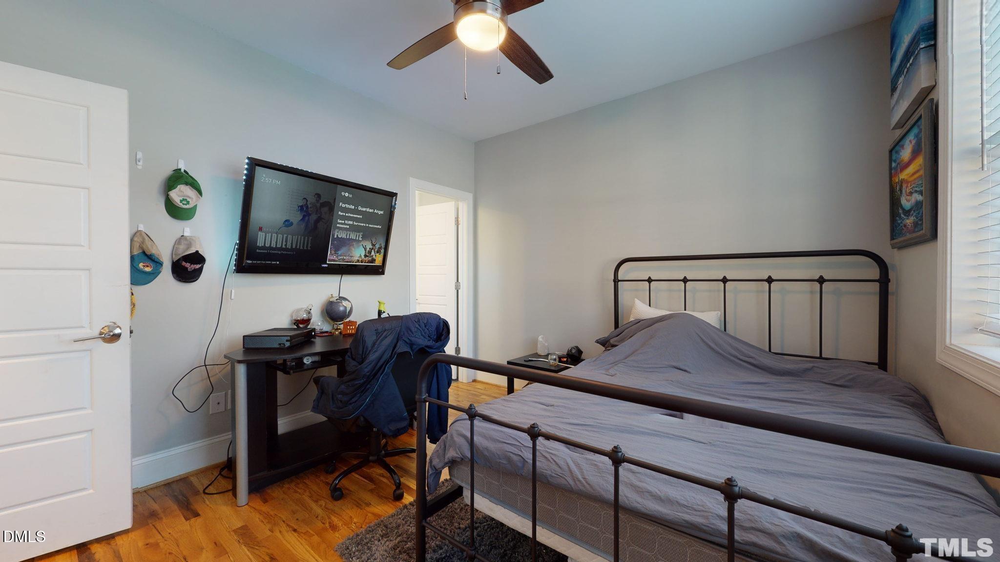 5012 Western Boulevard Raleigh, NC 27606 - Photo 13 of 24 a bedroom with furniture and a flat screen tv
