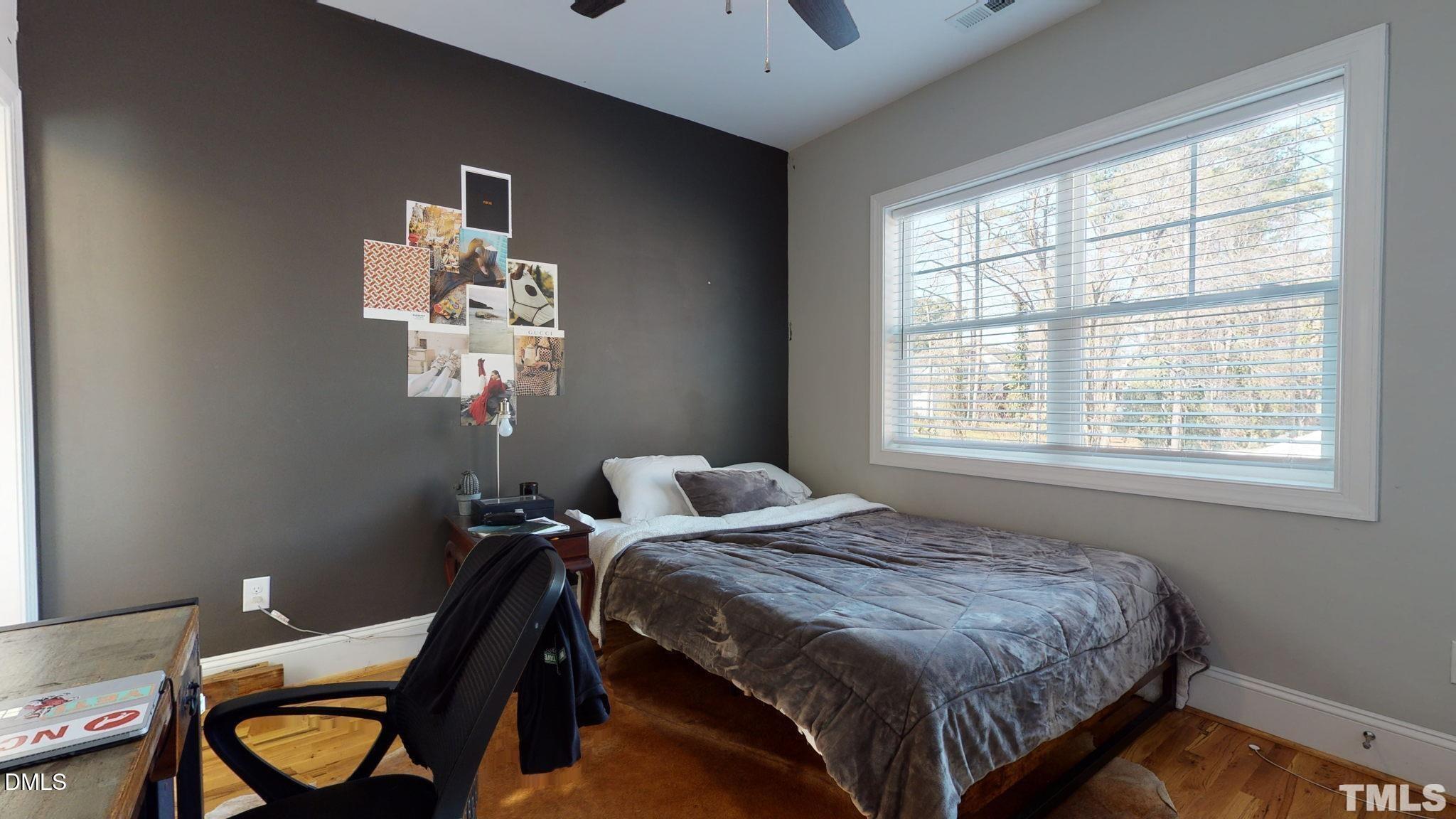 5012 Western Boulevard Raleigh, NC 27606 - Photo 23 of 24 a bedroom with a bed and a window