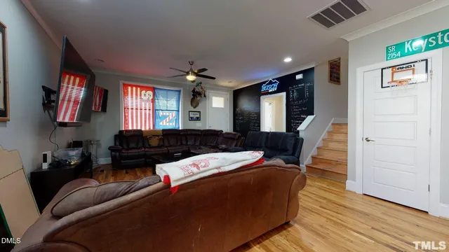 a living room with furniture and a flat screen tv