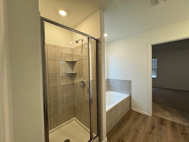 222 Carmello Kyle, TX 78640 - Photo 18 of 30 a bathroom with a glass shower door