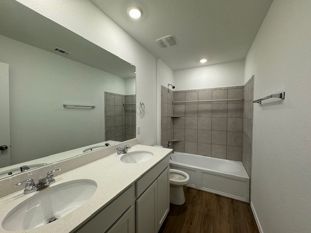 222 Carmello Kyle, TX 78640 - Photo 20 of 30 a bathroom with a sink a toilet and shower