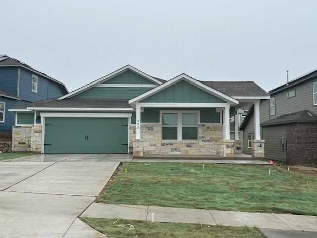 222 Carmello Kyle, TX 78640 - Photo 2 of 30 a front view of a house with outdoor seating yard and barbeque oven