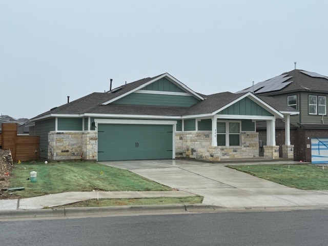 222 Carmello Kyle, TX 78640 - Photo 6 of 30 a front door view of a house with a yard