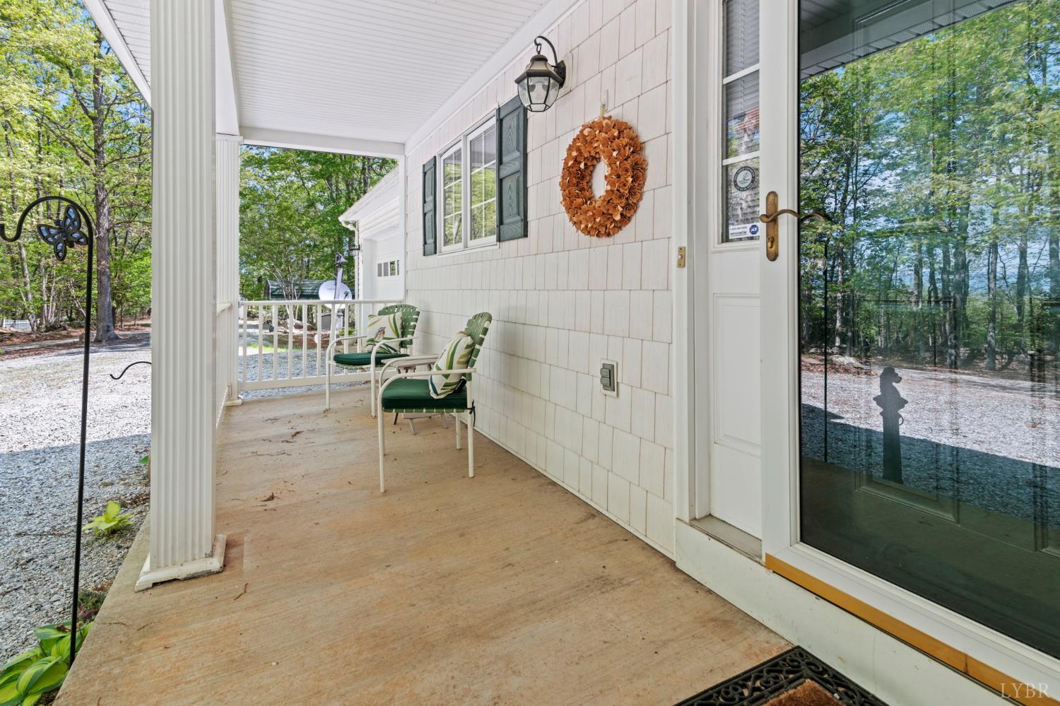 298 Braxton Ridge Road Amherst, VA 24521 - Photo 13 of 65 a view of a door and chair in the room