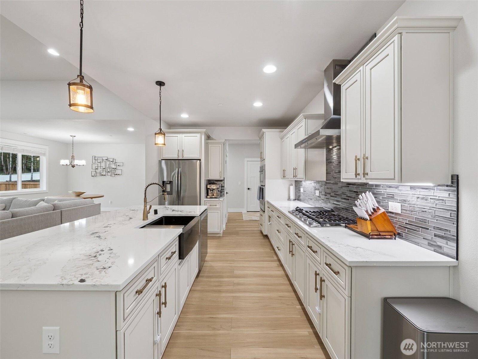 917 Tiedman Road Northwest Lakebay, WA 98349 - Photo 12 of 39 a large kitchen with kitchen island a large counter space a sink a window and stainless steel appliances