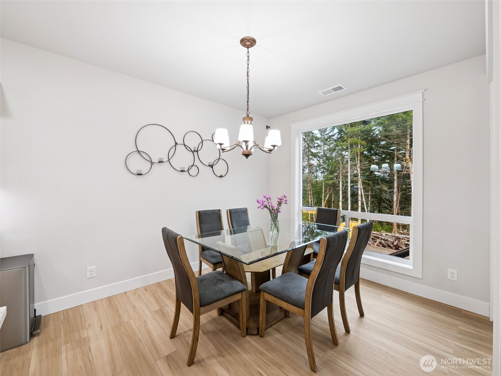 917 Tiedman Road Northwest Lakebay, WA 98349 - Photo 13 of 39 a view of a dining room with furniture window and wooden floor