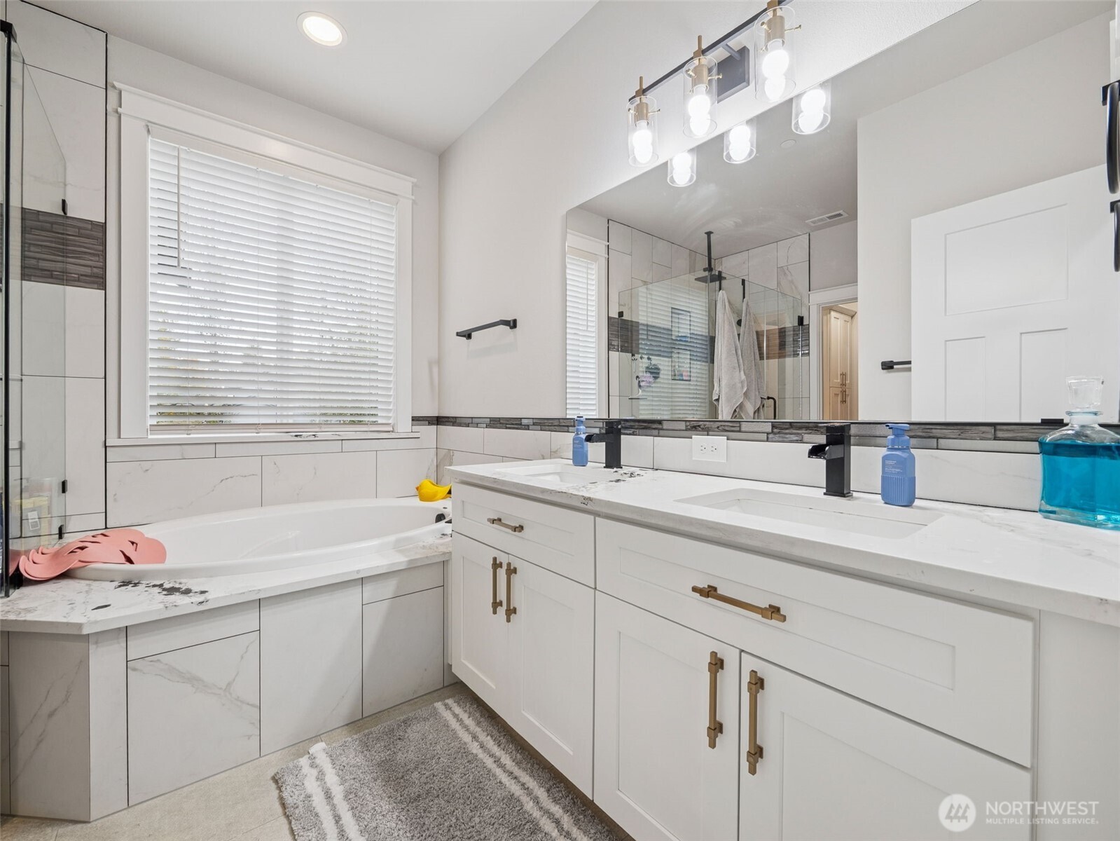 917 Tiedman Road Northwest Lakebay, WA 98349 - Photo 18 of 39 a bathroom with a sink double vanity and a mirror