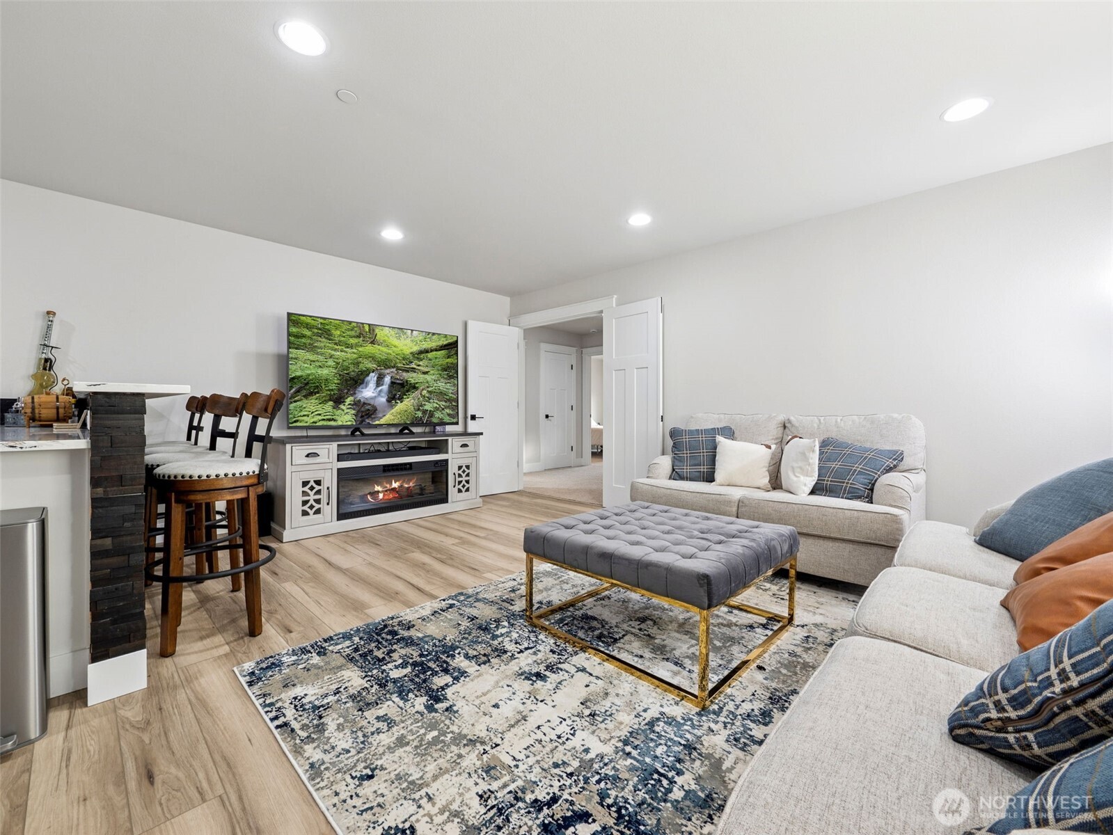 917 Tiedman Road Northwest Lakebay, WA 98349 - Photo 22 of 39 a living room with furniture and a flat screen tv