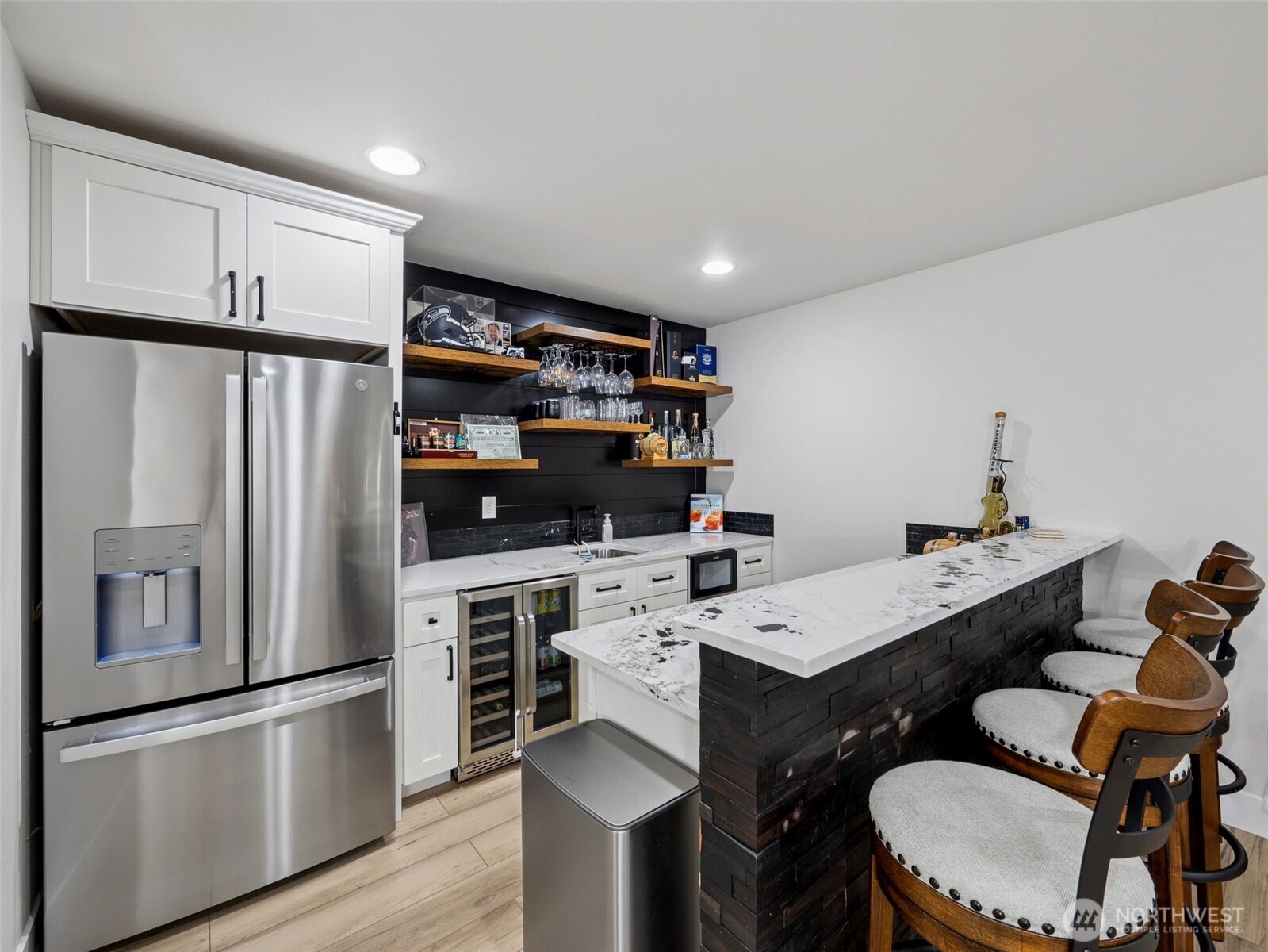 917 Tiedman Road Northwest Lakebay, WA 98349 - Photo 23 of 39 a kitchen with stainless steel appliances a refrigerator a sink a stove a table and chairs