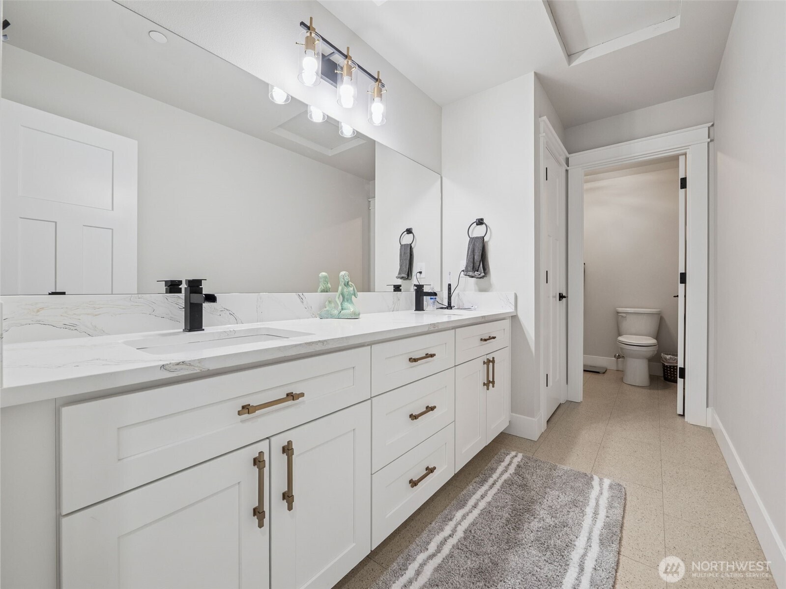 917 Tiedman Road Northwest Lakebay, WA 98349 - Photo 26 of 39 a bathroom with a double vanity sink double and mirror