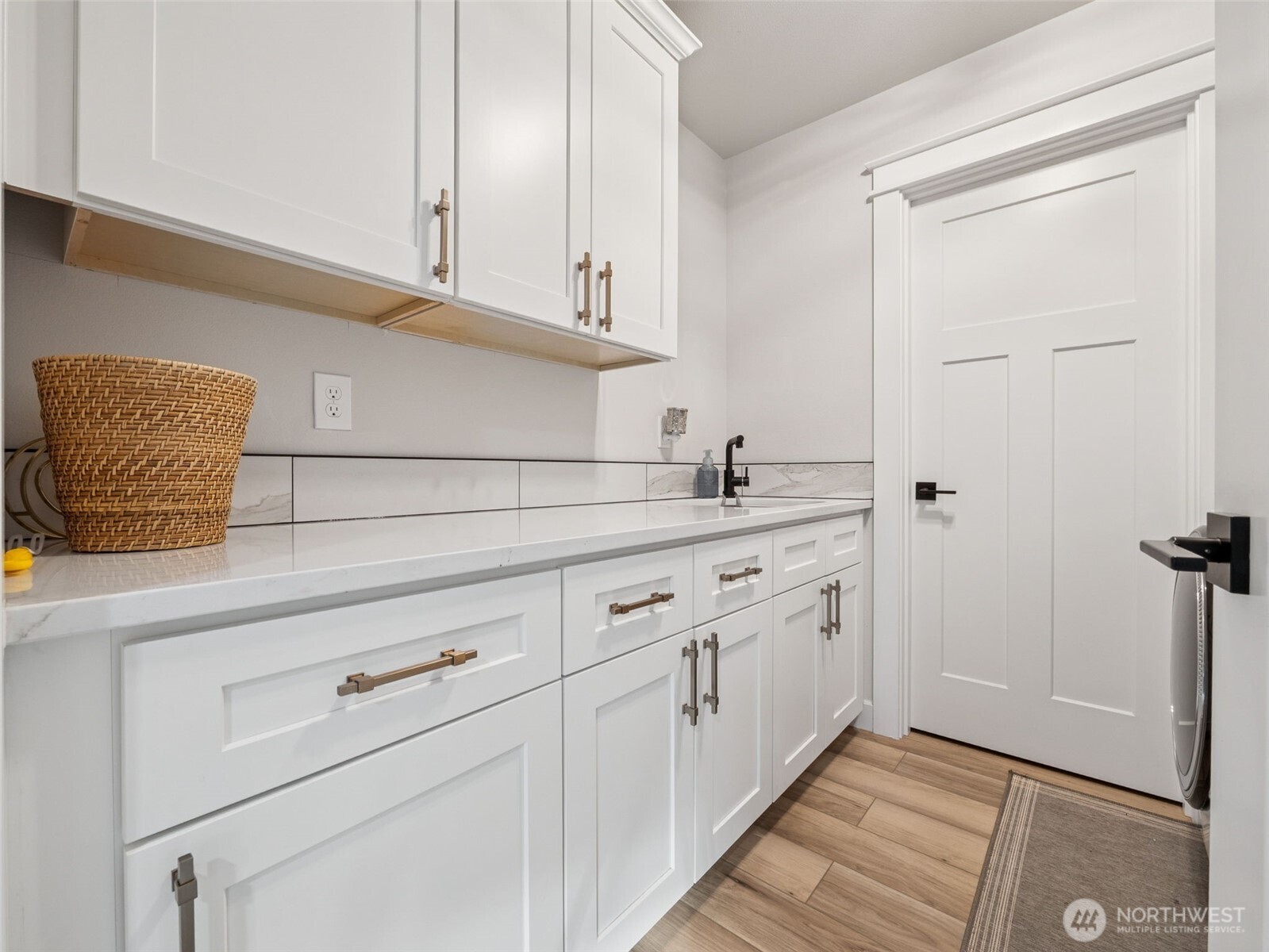 917 Tiedman Road Northwest Lakebay, WA 98349 - Photo 28 of 39 a view of cabinets a sink and dishwasher in a kitchen