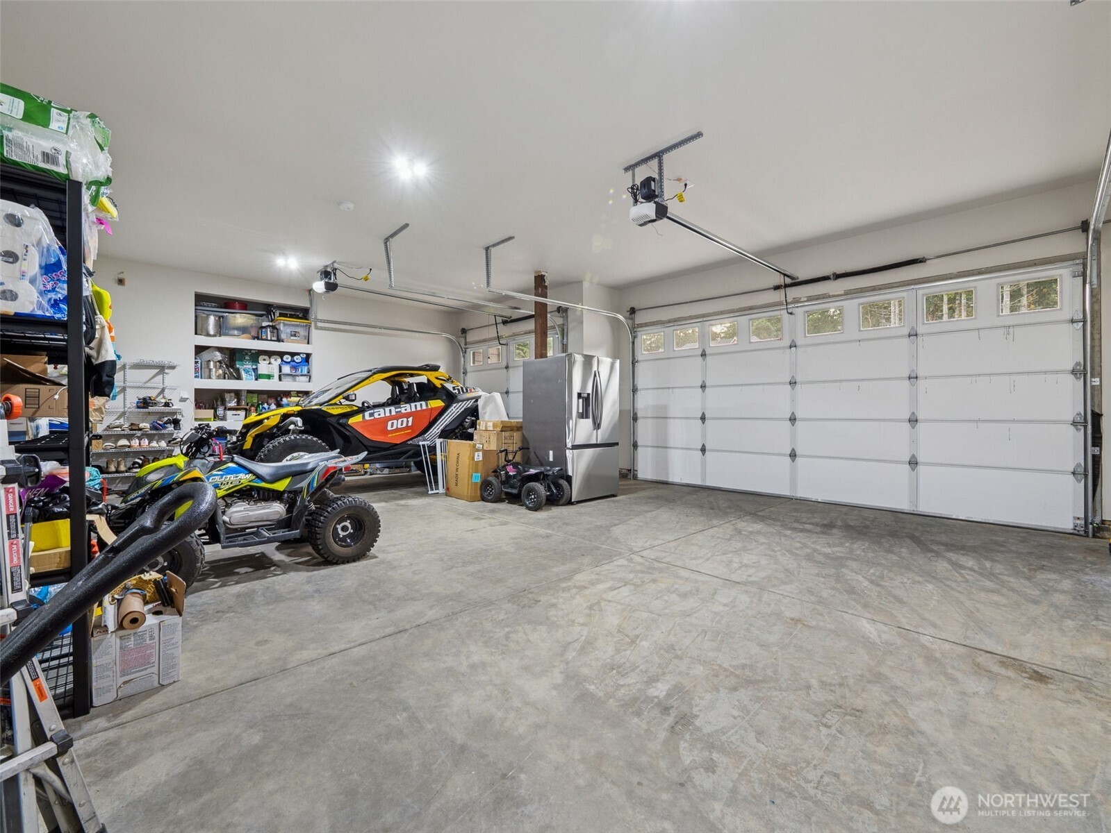 917 Tiedman Road Northwest Lakebay, WA 98349 - Photo 29 of 39 a view of a garage with parked cars