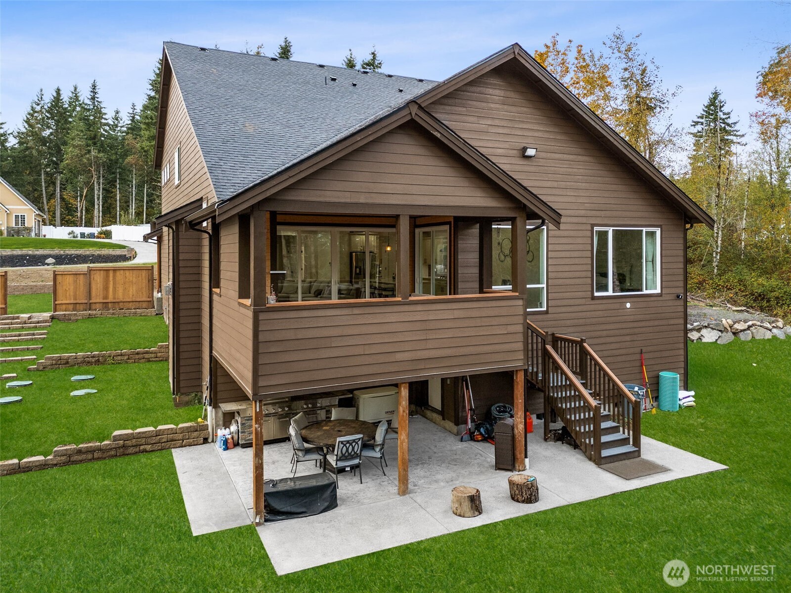 917 Tiedman Road Northwest Lakebay, WA 98349 - Photo 31 of 39 a view of a house with a yard patio and a slide