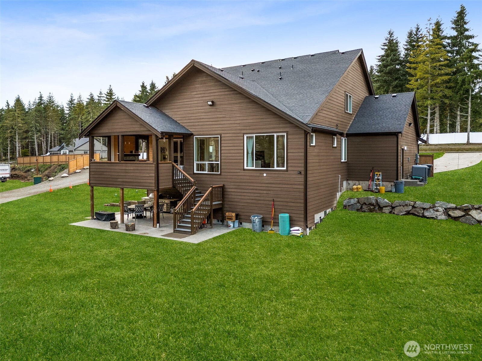 917 Tiedman Road Northwest Lakebay, WA 98349 - Photo 33 of 39 a view of a house with backyard and sitting area