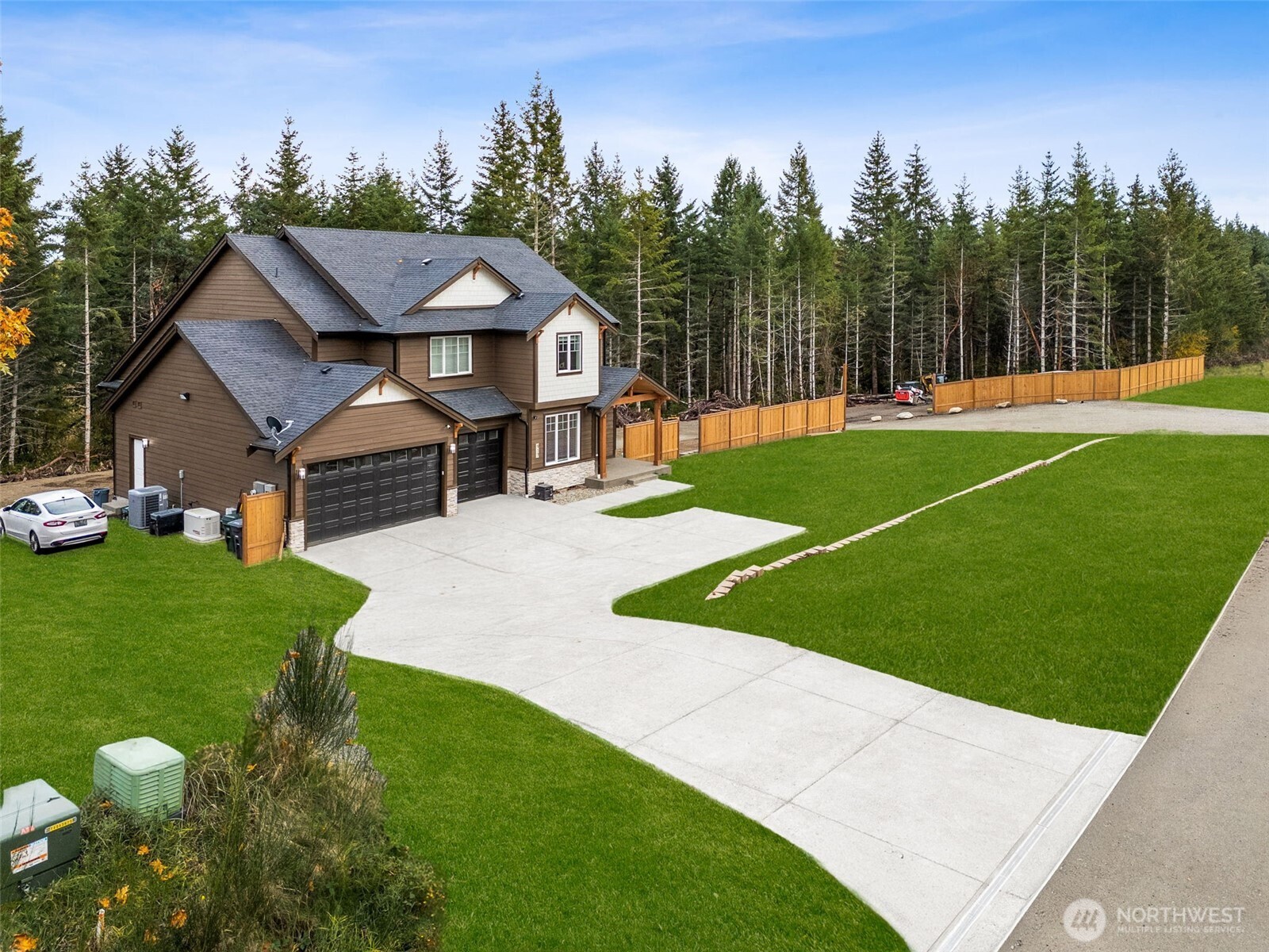 917 Tiedman Road Northwest Lakebay, WA 98349 - Photo 35 of 39 a view of a house with a swimming pool and a yard