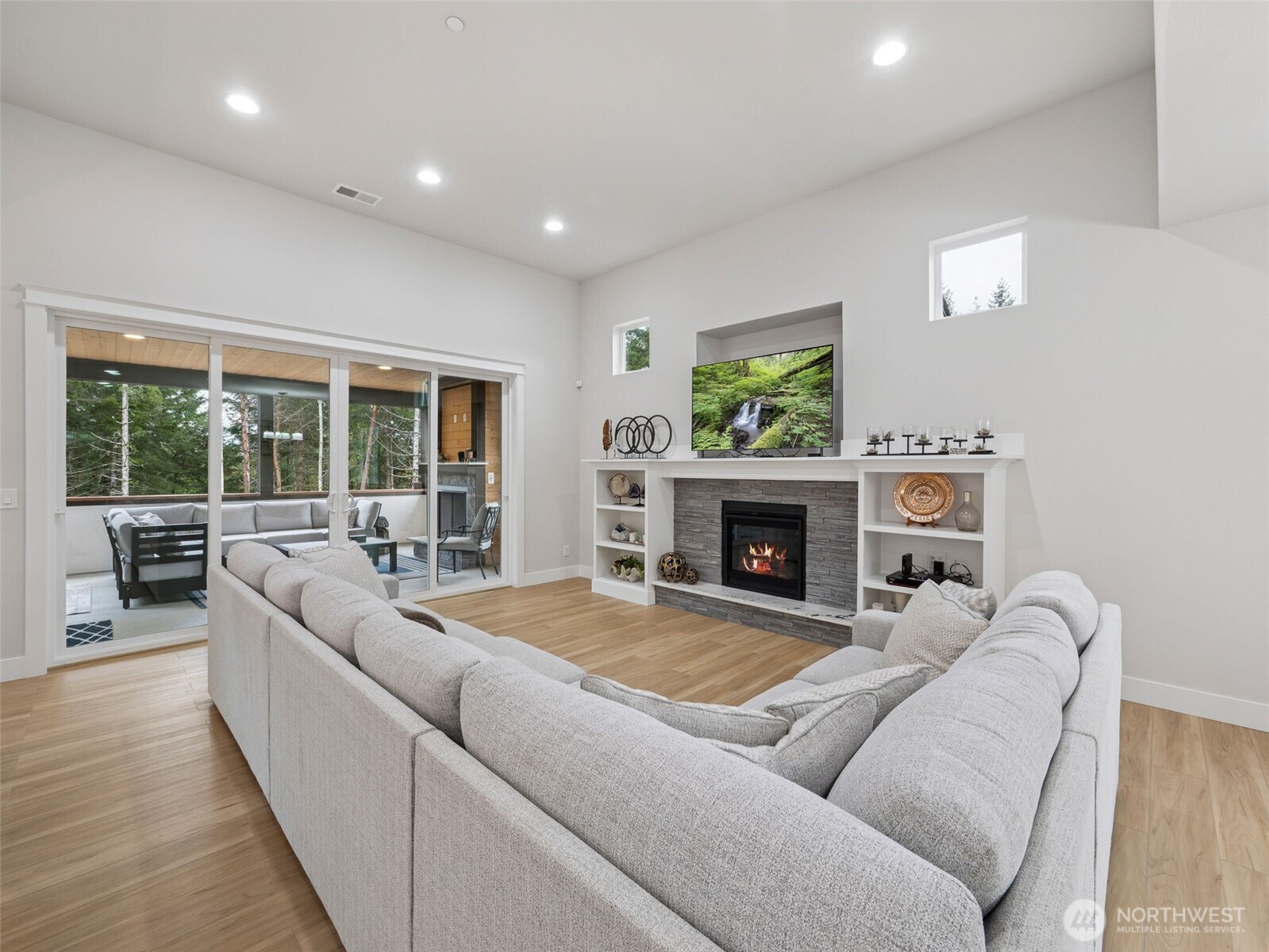 917 Tiedman Road Northwest Lakebay, WA 98349 - Photo 6 of 39 a living room with furniture and a fireplace