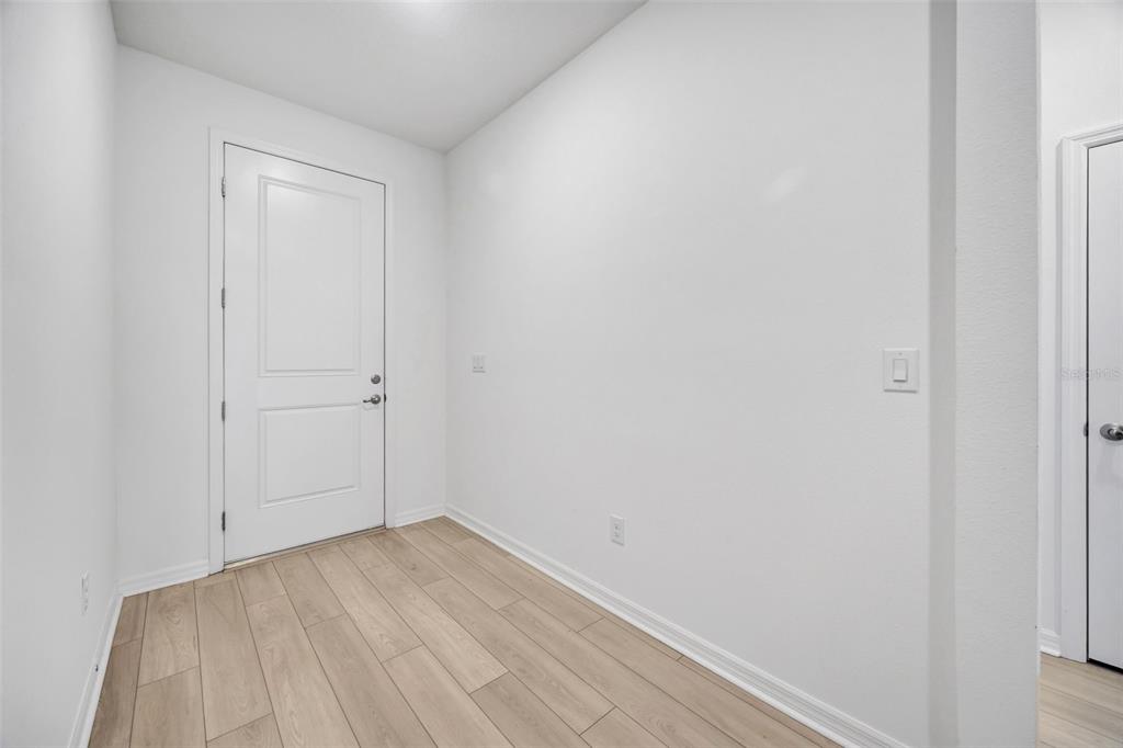 7882 Lennox Loop Wesley Chapel, FL 33544 - Photo 27 of 58 a view of a small space with wooden floor