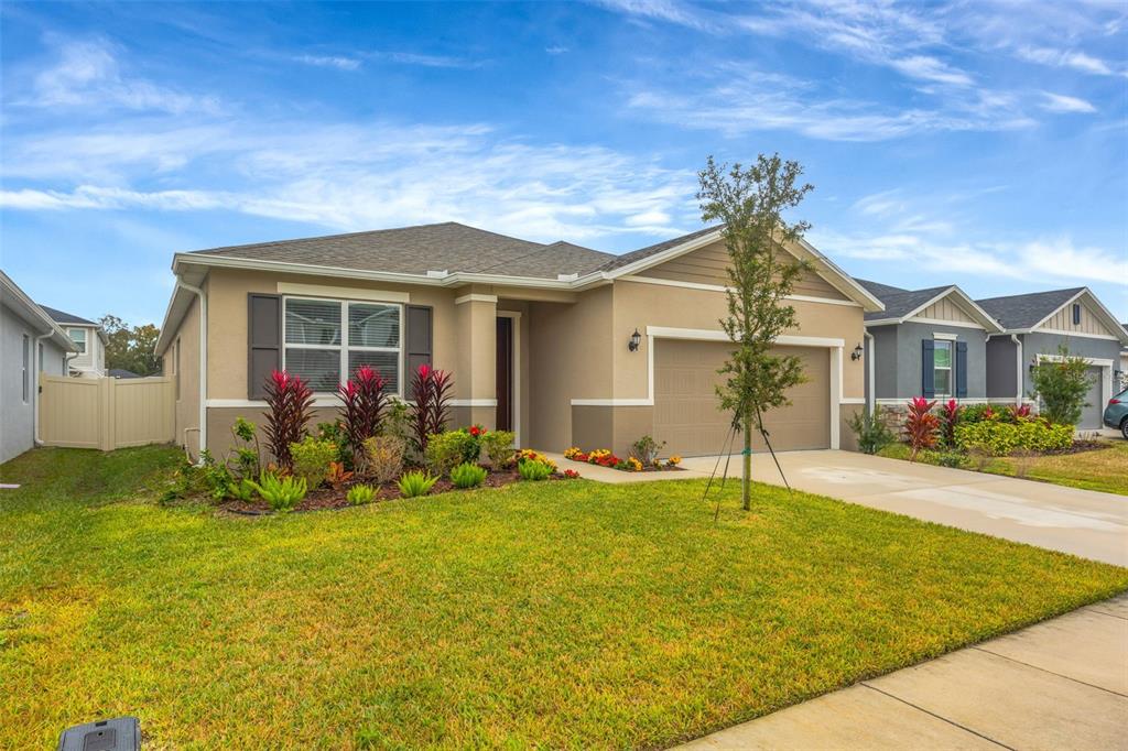 7882 Lennox Loop Wesley Chapel, FL 33544 - Photo 4 of 58 a view of a house with a swimming pool