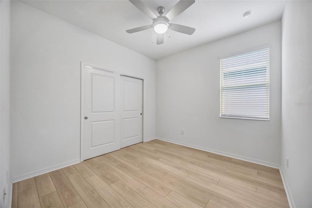 7882 Lennox Loop Wesley Chapel, FL 33544 - Photo 48 of 58 a view of an empty room with a window