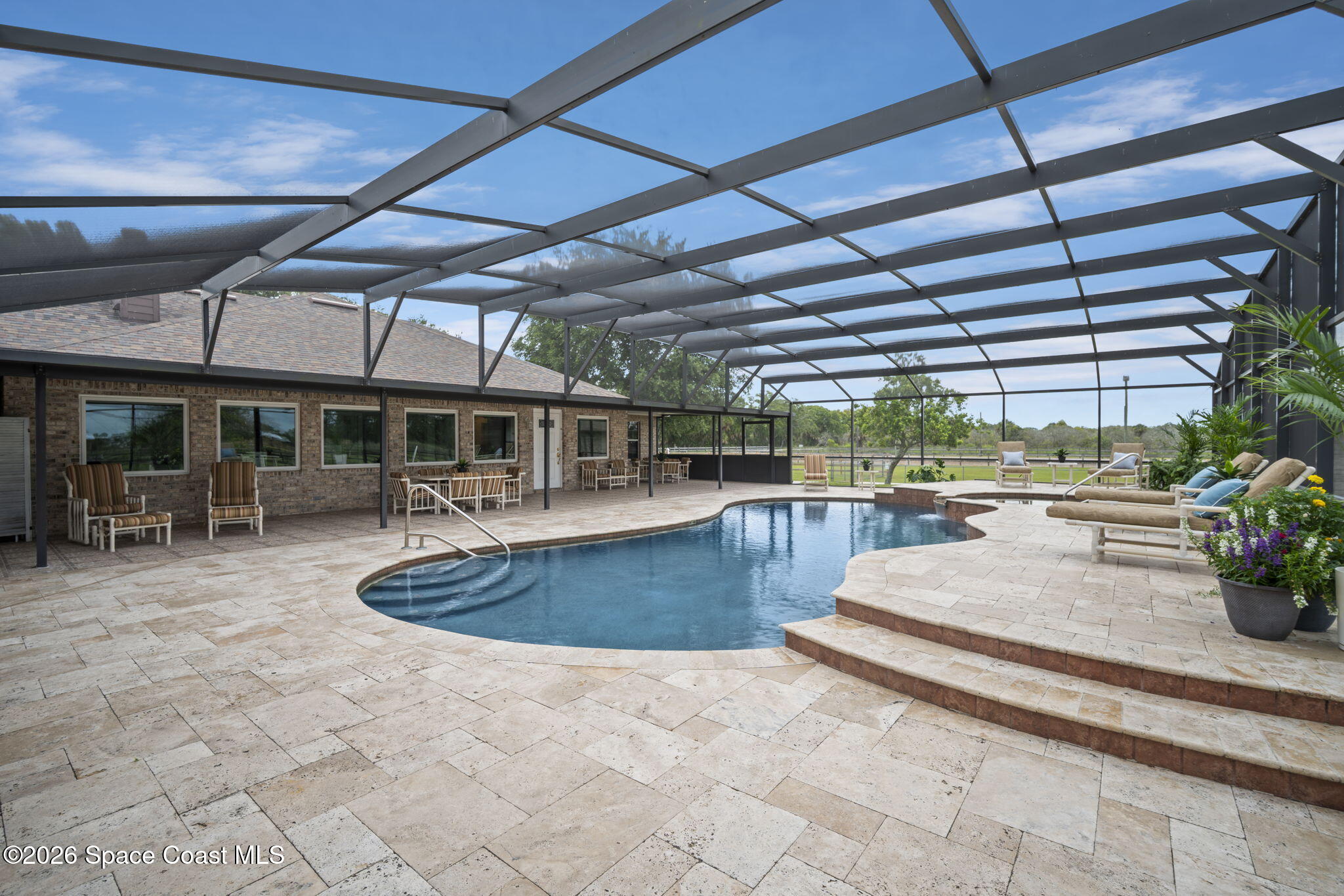 3125 Davis Road Mims, FL 32754 - Photo 3 of 47 a view of a swimming pool with outdoor seating