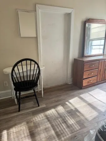 a view of room with furniture and a window