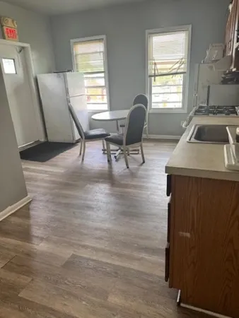 a view of a livingroom with furniture and a window
