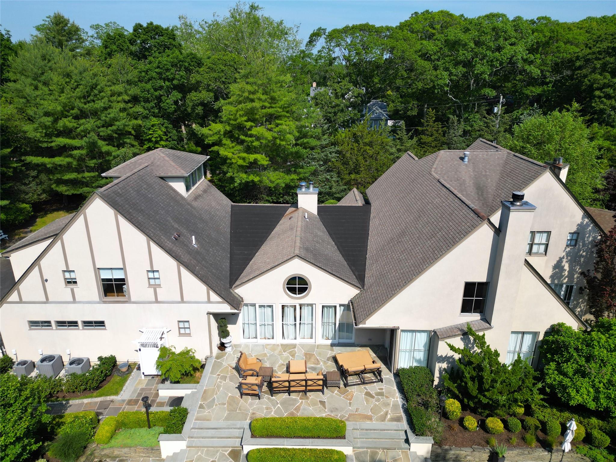 an aerial view of a house with a yard