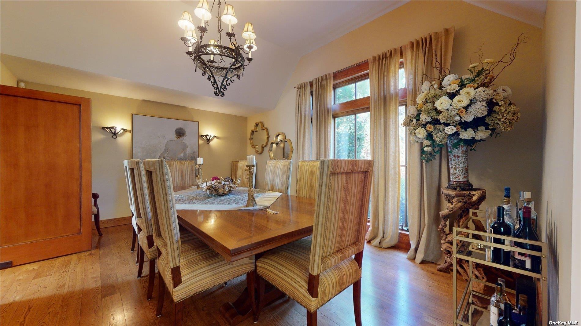 10 Cedar Lane Remsenburg, NY 11960 - Photo 7 of 37 a view of a dining room with furniture wooden floor and chandelier