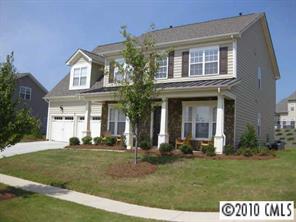 747 Quicksilver Trail Fort Mill, SC 29708 - Photo 1 of 8 front view of a brick house with a yard